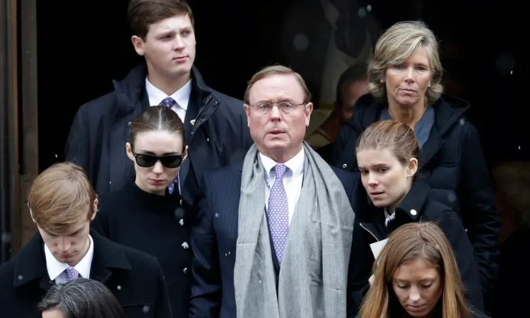 Kathleen McNulty Rooney's husband Chris Mara with her daughters, Rooney Mara and Kate Mara at a family funeral. 